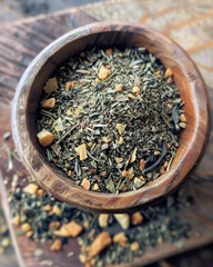soothing blend of herbal tea leaves and spices in wooden bowl, perfect for relaxation