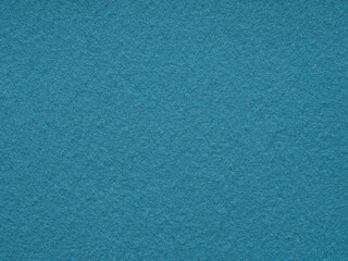 Whispers of azure tranquility dance across a textured felt canvas, evoking a serene simplicity