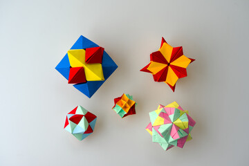 Obraz premium Close-up of colorful origami paper cubes against white background. Photo taken February 16th, 2025, Zurich, Switzerland.