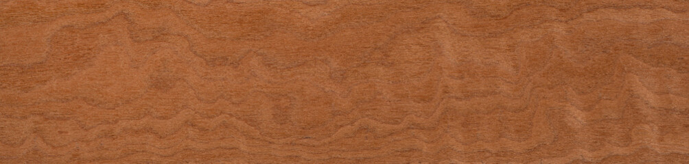 Warm caramel waves flow across a smooth mahogany veneer surface