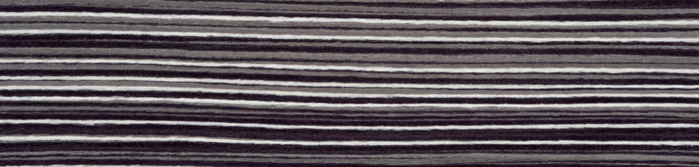 Urban stripes in shades of charcoal and ash ripple across this elegant veneer surface