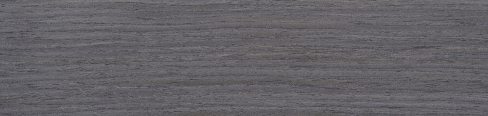 Layers of deep charcoal and subtle slate striations flow seamlessly across this luxurious, dark ash wood veneer surface