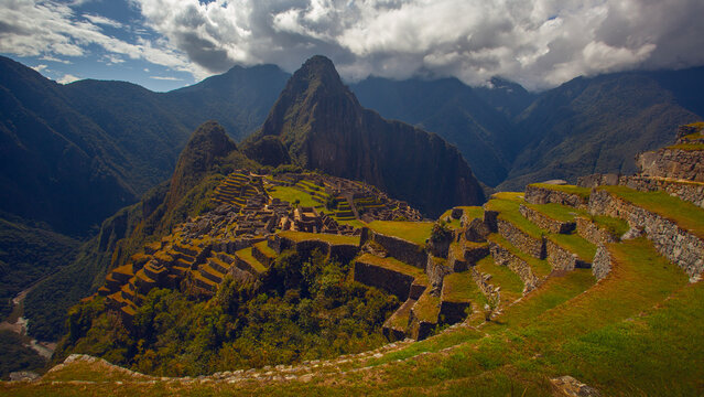 Panoramic view of Machu Picchu on a beautiful sunny day, The Valley of the Incas, Cuzco, Peru. Famous and tourist place in South America.