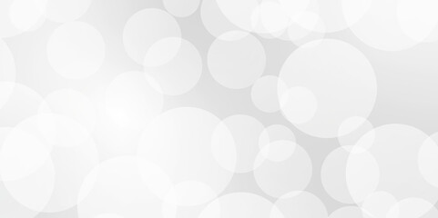 Blurry white sparkling and shiny abstract background. A brilliant blurry white background for a festive mood. Template for greeting card for entertainment.