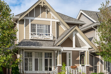Big luxury home with front yard in the suburbs of North America. Real Estate Exterior Front Houses