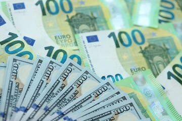 Big pile of Euro and USD banknotes. Many european and united states dollars