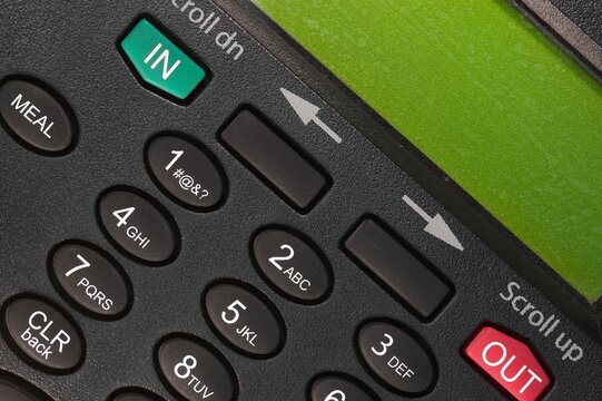 Close up view of a digital time clock for employees