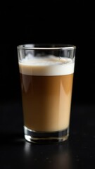 Glass cup of hot cappuccino coffee, latte with whipped cream. Idea for a delicious breakfast at home or in a cafe. Photo minimalism in low key