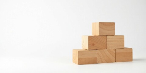 Simple Wooden Blocks Arranged in a Pyramid Shape on a White Background
