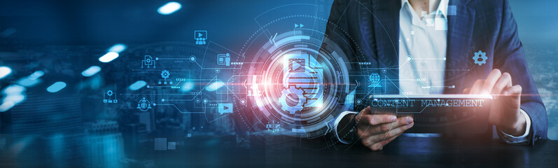 Businessman using tablet analyzing content management strategies, data analytics, market trends,...
