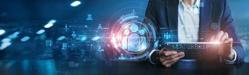 Businessman using tablet to analyze leadership strategies, market trends, team performance, growth potential, competitive advantages, financial forecasting, operational efficiency, and decision-making