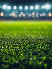 Naklejka premium Empty football soccer field under bright sunlight, ready for a match. The vivid green grass and clear sky create a perfect setting for a professional game.