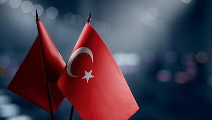 Small flags of the Turkey on an abstract blurry background
