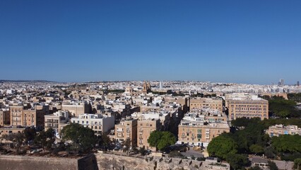 Obraz premium St.Paul's Cathedral and Our Lady of Mount Carmel Basilica at Valletta, Malta, Aerial backwards shot. High quality photo