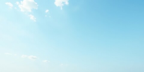 Serene Light Blue Sky with Delicate White Clouds Forming a Peaceful and Tranquil Atmosphere Ideal for Backgrounds and Design Projects