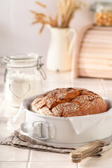 Healthy round loaf bread baked in home bakery.