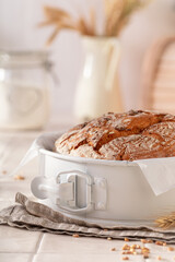 Fresh round loaf bread baked in home bakery.