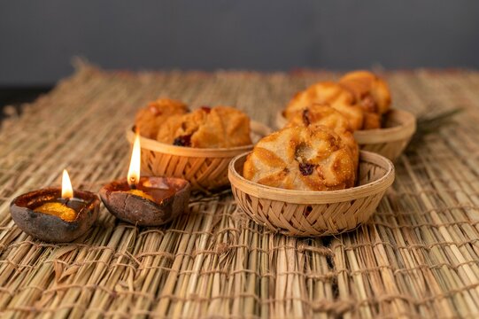 Traditional Thekua, a sweet crispy snack from Bihar made with jaggery and wheat flour, often prepared during festivals and special occasions.
