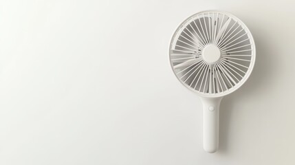 Handheld Fan Display on White Background with Blank Space for Design