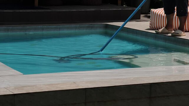 Cleaning the swimming pool in the resort