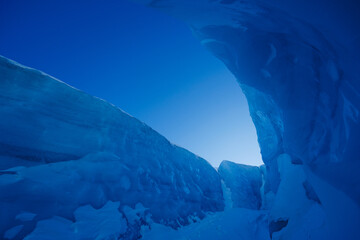 Narrow passage created by nature with towering ice on both sides