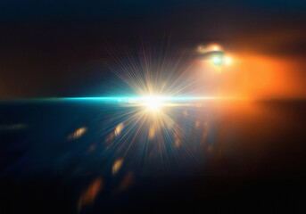 Obraz premium A blurred, abstract image with a vibrant blue light streaking across the horizon, with orange and yellow lights in the top right corner.