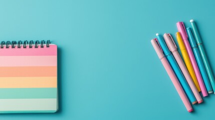 Fototapeta premium Transgender Day of Visibility concept. Vibrant Stationery Arrangement on Turquoise Background