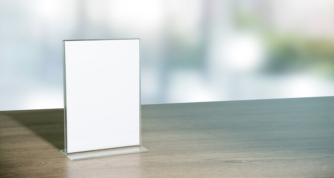 Stand Mock up Menu frame tent card blurred background design key visual layout in cafe.