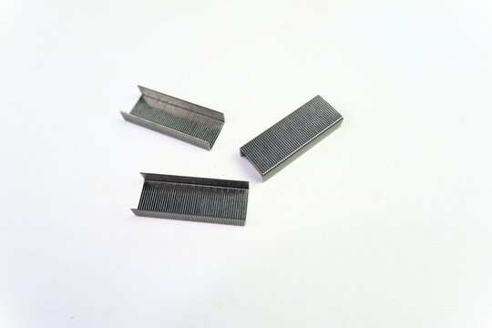 Sharp metal stapler refill on white background