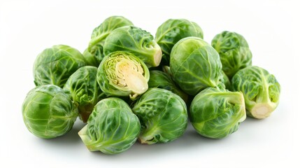 Fototapeta premium Fresh Brussels sprouts piled together, showcasing their vibrant green color and unique texture.