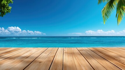 Fototapeta premium A serene beach scene featuring a clear blue sky, calm ocean waves, and wooden decking surrounded by tropical greenery.