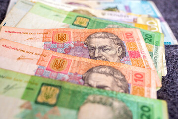 Various Ukrainian hryvnia banknotes spread out