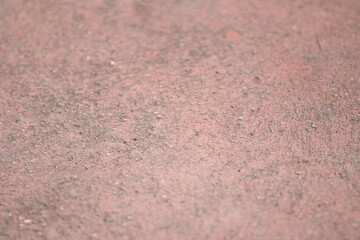Red Clay Texture: A close-up macro shot revealing the intricate texture of rough, red clay. The earthy tones and subtle variations in the surface create a captivating abstract backdrop.