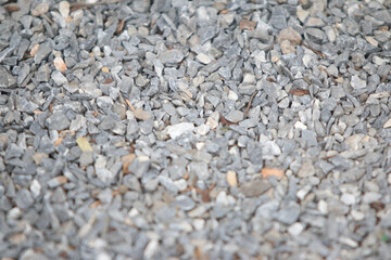Grey Gravel Texture: A close-up shot of a textured gravel surface, showcasing the intricate details of the grey pebbles in a natural arrangement.