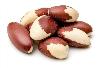 Close up view of a small pile of nuts against a clean white background. The nuts are reddish brown with creamy white sections, showing natural