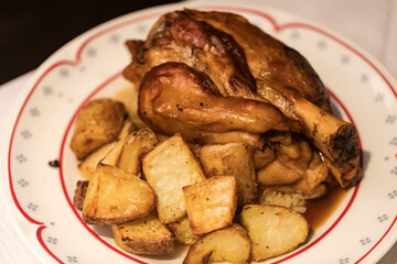 Pork knuckle baked with potatoes