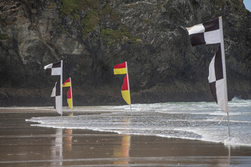 Flags on the beach for swimming and surfing in Cornwall U.K.