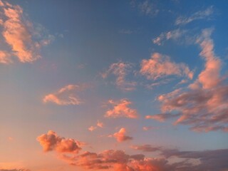 Fototapeta premium Cloudscape, Colored Clouds at Sunset near the Ocean on a Cloudy Day