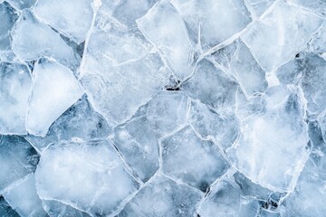 Cracked Ice: An overhead shot reveals fractured, translucent sheets in a mosaic of frozen textures