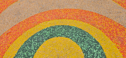 Rubber floor mats or fitness rubber floors in orange, green and black. Rough surface, uneven color....