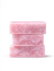 A stack of beautifully crafted pink soap bars for a luxurious bathing experience.