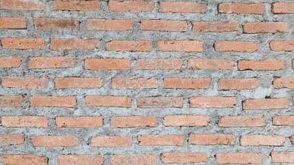 Red, brown brick, vintage brick fence background, arranged in rows, brick wall texture and background, red brick wall texture.