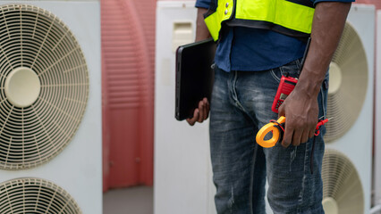 Fototapeta premium Engineers inspecting the air conditioning system in a large building or industrial facility.