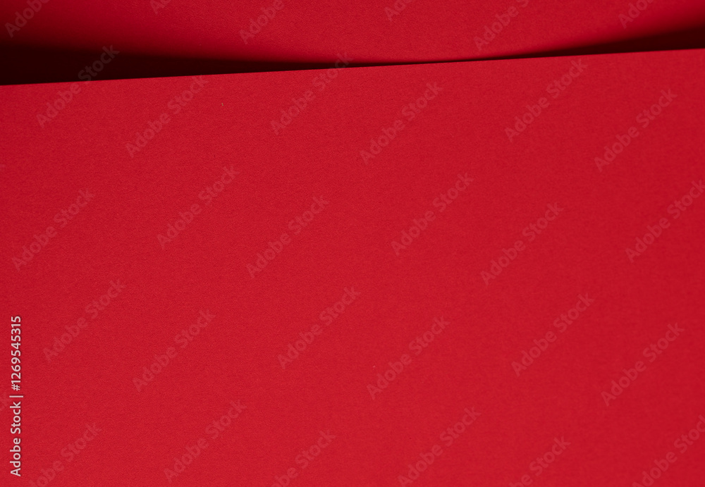 Poster Bold scarlet red paper background with a deep matte texture and overlapping folds. Smooth geometric lines and subtle shadows create an elegant, vibrant, and minimal abstract design.