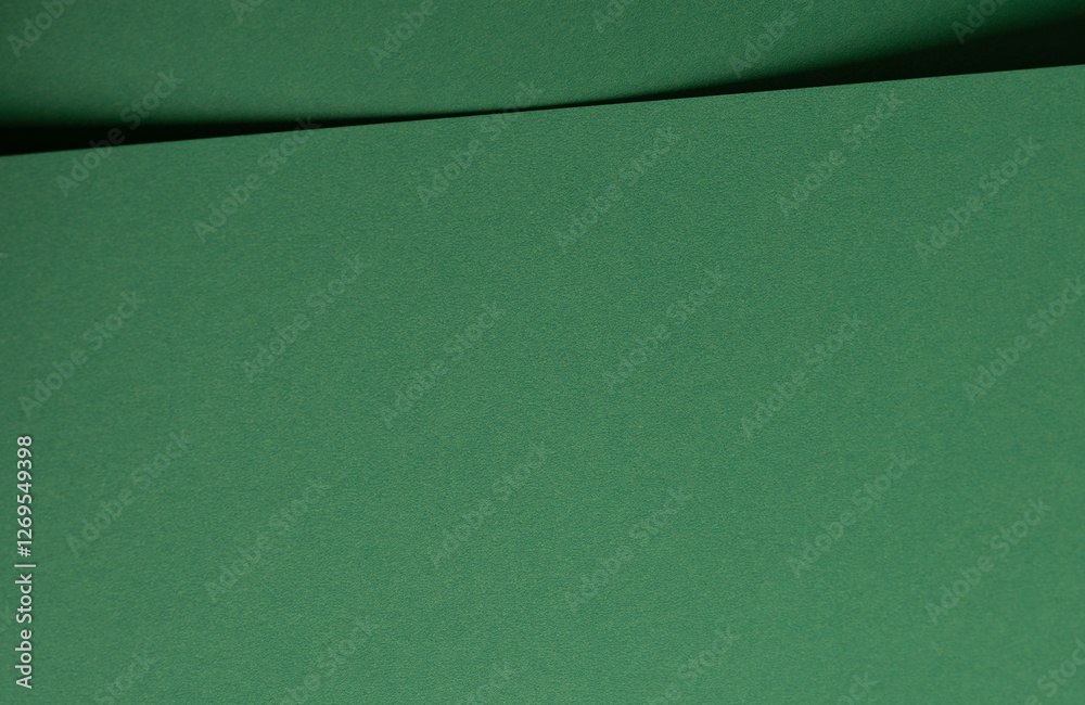 Poster Deep emerald green paper background with a smooth texture and elegant folds. Rich forest and pine tones create a refined, minimal, and artistic abstract design with subtle curves and shadows.