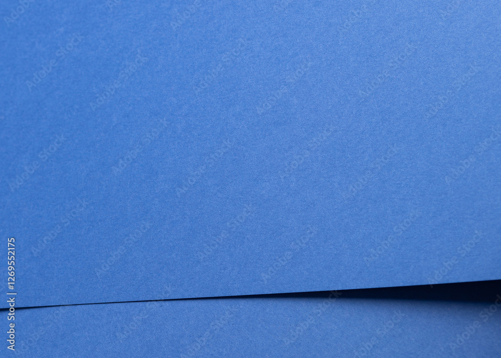 Poster Deep sapphire blue paper background with a smooth texture and overlapping curved folds. Vibrant cobalt and ultramarine tones create a minimal, rhythmic, and flowing abstract composition with geometric