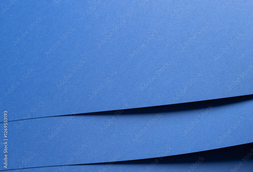 Poster Deep sapphire blue paper background with smooth texture and overlapping curved folds. Vibrant cobalt and ultramarine tones create a minimal, rhythmic, and flowing abstract composition with subtle