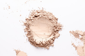 A sample of dry cosmetic clay for a mask or cosmetic powder. White background