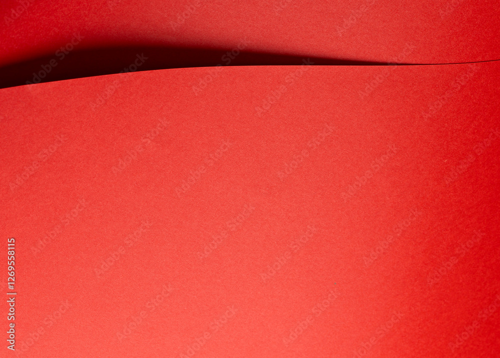 Aufkleber Fiery vermilion red paper background with a smooth texture and overlapping curved folds. Warm coral tones and dynamic geometric lines create a minimal, flowing abstract composition with subtle shadows