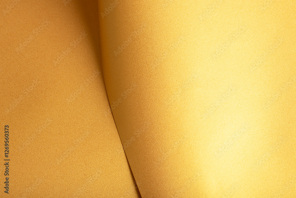 Aufkleber golden saffron paper background with a pearlescent, glossy texture and shimmering folds. rich butter
